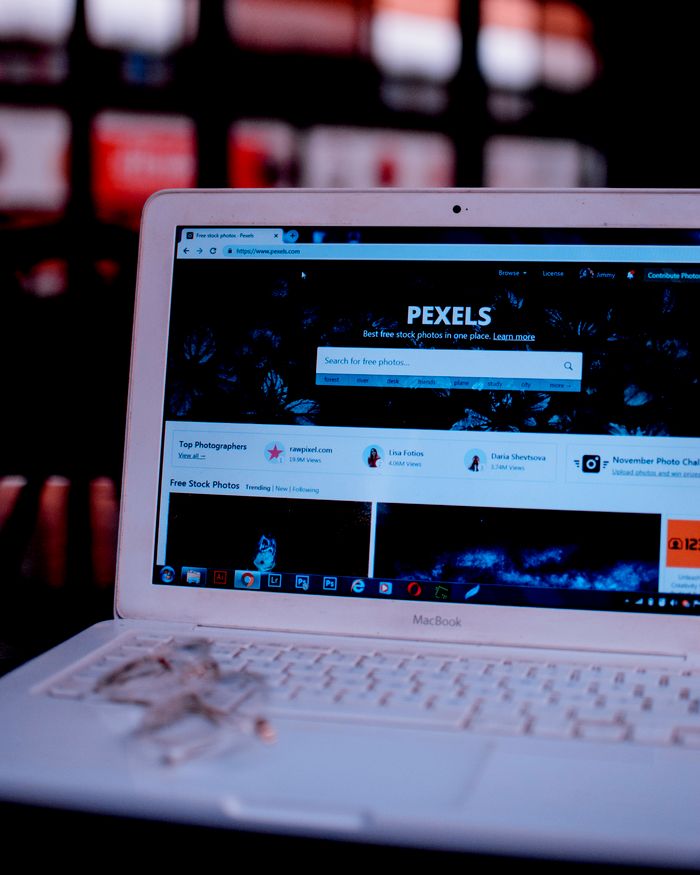 about-us-01 Laptop on a desk showing the Pexels homepage, highlighting its web interface.